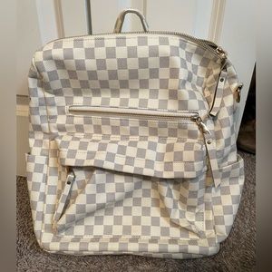 White and grey checkered backpack